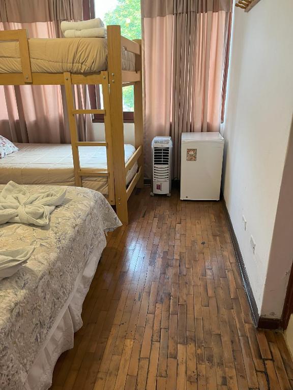 Ένα ή περισσότερα κρεβάτια σε δωμάτιο στο Harmony Inn Miraflores