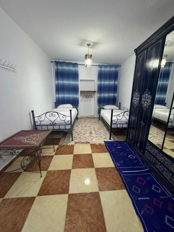 Cama o camas de una habitación en Bleu home