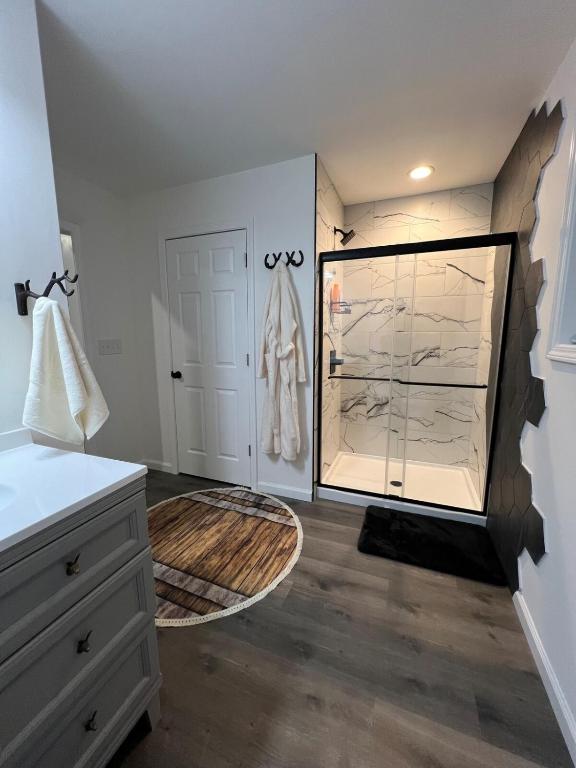 a bathroom with a walk in closet with a mirror at Downtown Bourbon House in Somerset