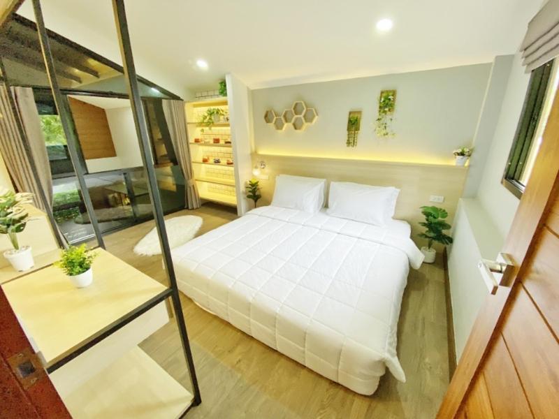 Letto o letti in una camera di Ploy Mountain View Pool Villa