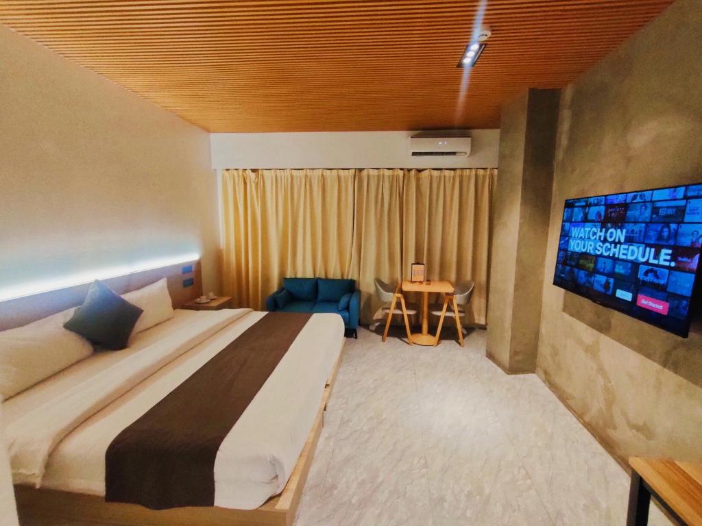 Postel nebo postele na pokoji v ubytování Terra Hotel Kawit