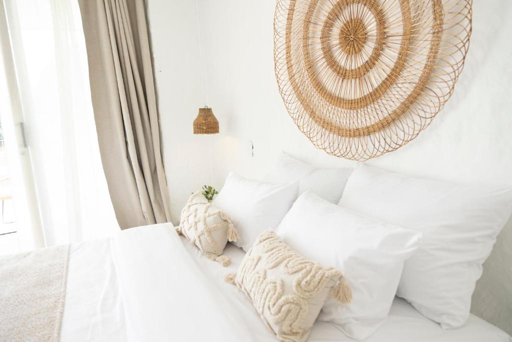 Postel nebo postele na pokoji v ubytování MYLOS Hotel Boutique