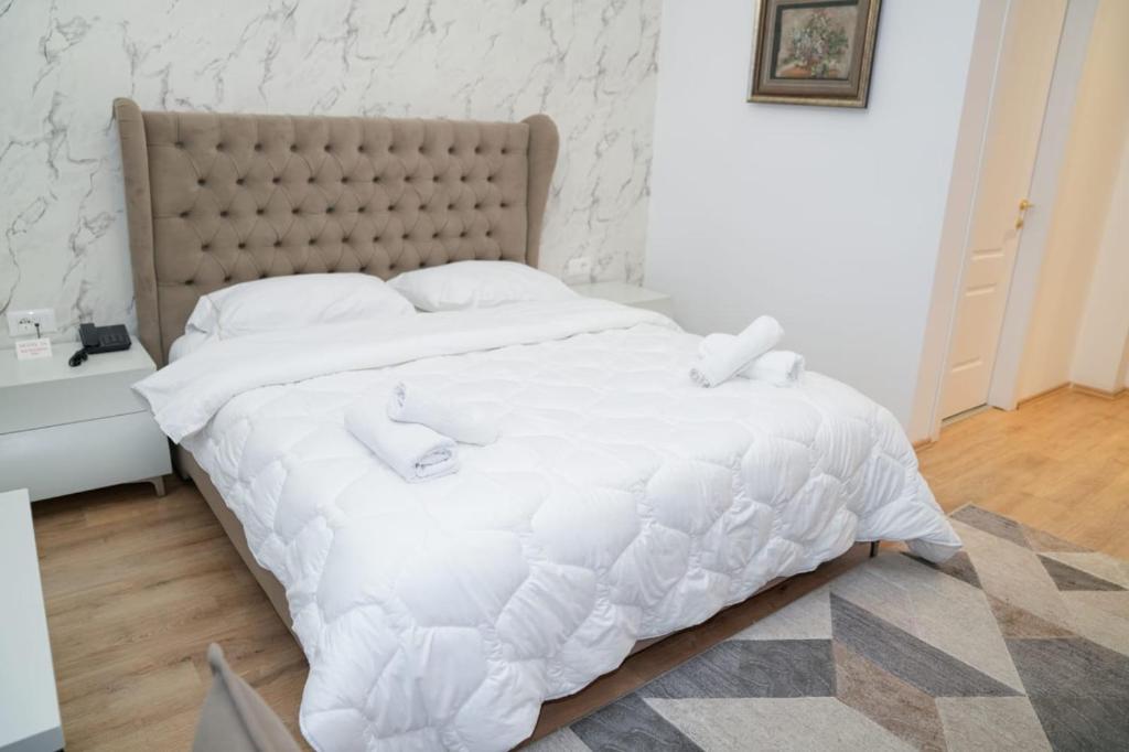 Postel nebo postele na pokoji v ubytování Kashar Hotel 3A