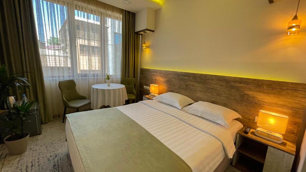 Postel nebo postele na pokoji v ubytování RG Boutique Hotel
