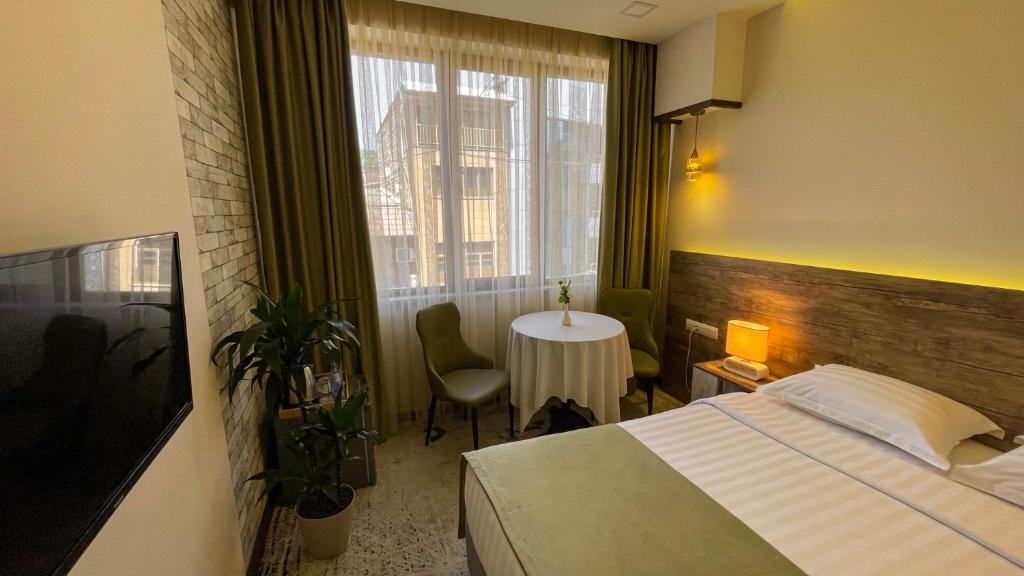 Postel nebo postele na pokoji v ubytování RG Boutique Hotel