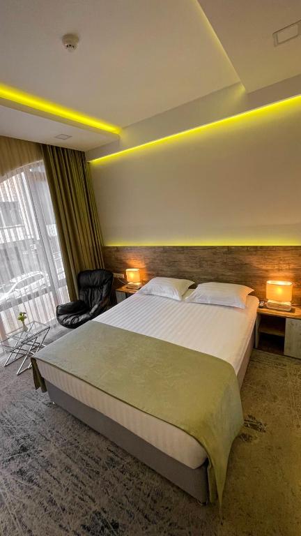 Postel nebo postele na pokoji v ubytování RG Boutique Hotel