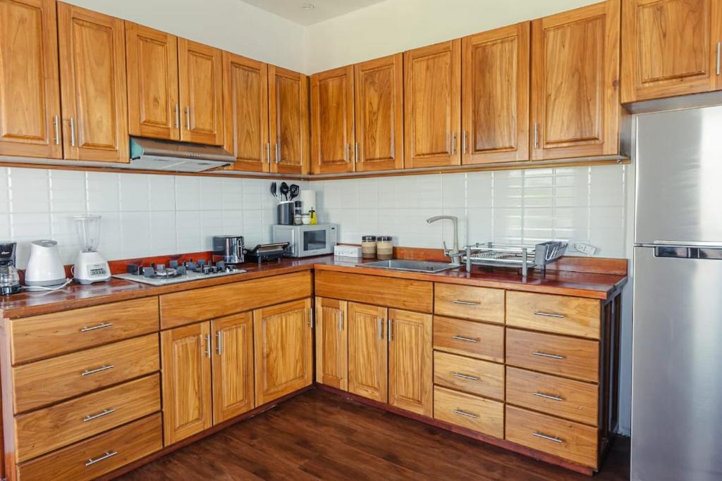 Kuchyň nebo kuchyňský kout v ubytování Chango's Apartments