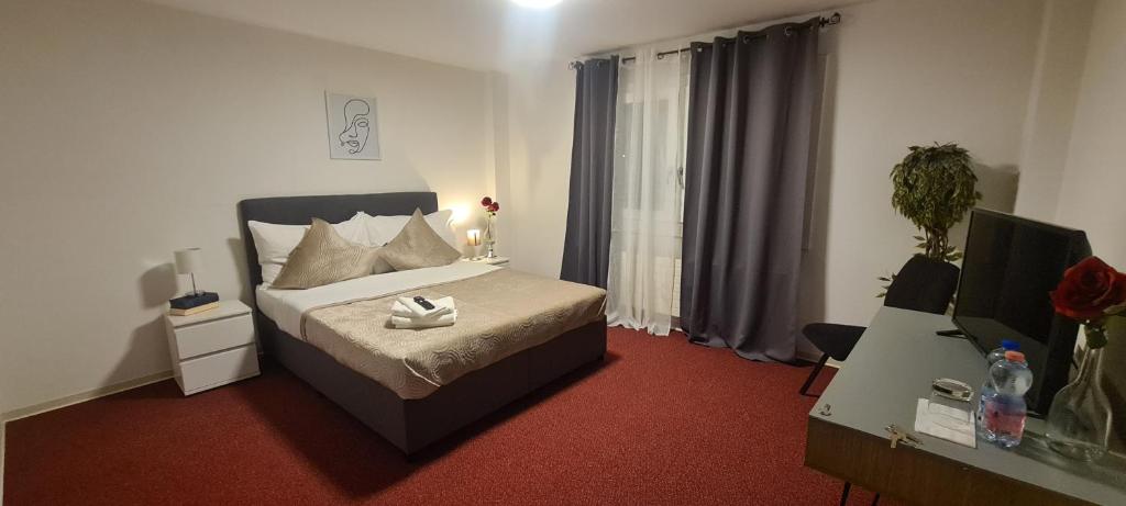 Postel nebo postele na pokoji v ubytování Hotel Garni
