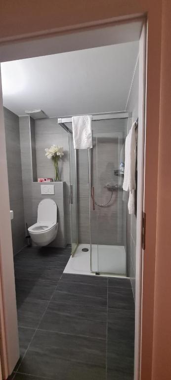 Koupelna v ubytování Hotel Garni