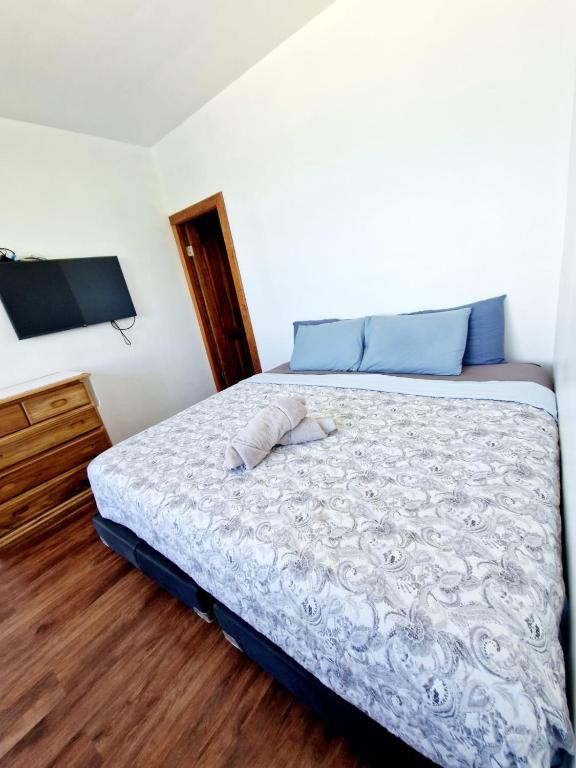 Postel nebo postele na pokoji v ubytování Chango's Apartments