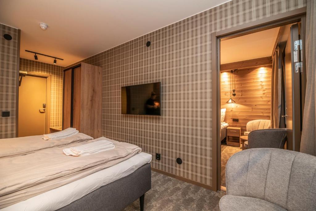 Postel nebo postele na pokoji v ubytování Matarengi Lodge