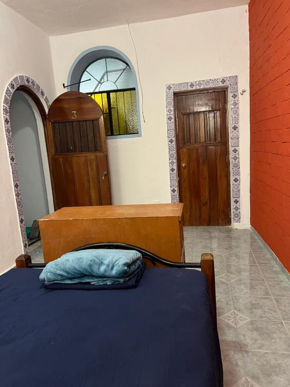 Ліжко або ліжка в номері Hostal Patio Nómada