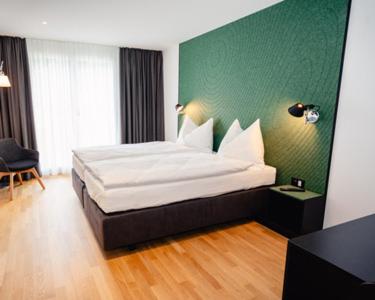 Postel nebo postele na pokoji v ubytování CENTRINO Apartments