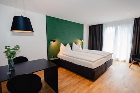 Postel nebo postele na pokoji v ubytování CENTRINO Apartments