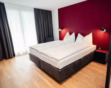 Postel nebo postele na pokoji v ubytování CENTRINO Apartments