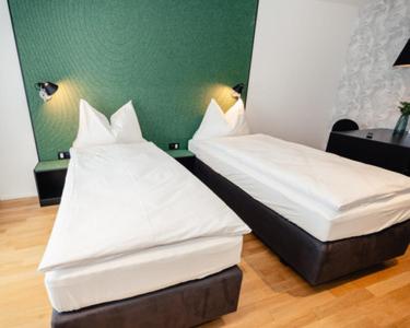 Postel nebo postele na pokoji v ubytování CENTRINO Apartments