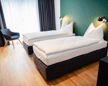 Postel nebo postele na pokoji v ubytování CENTRINO Apartments