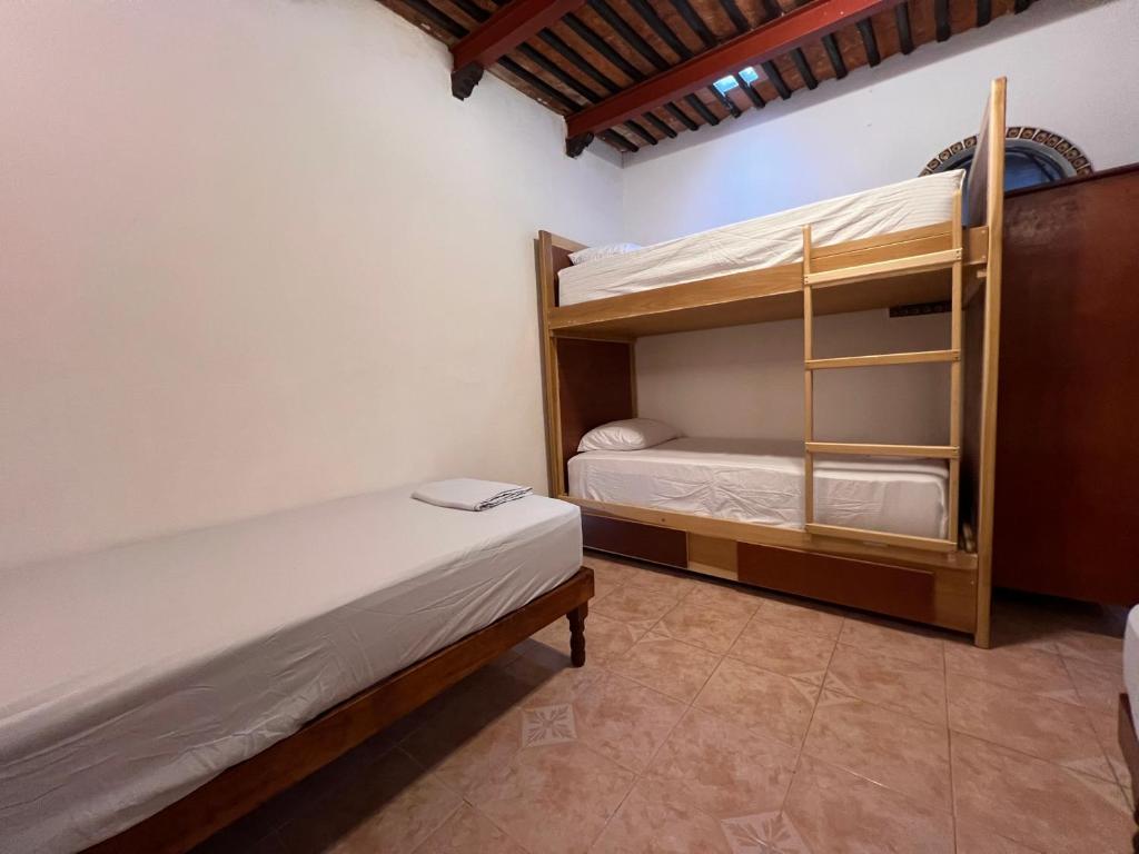 Ліжко або ліжка в номері Hostal Patio Nómada