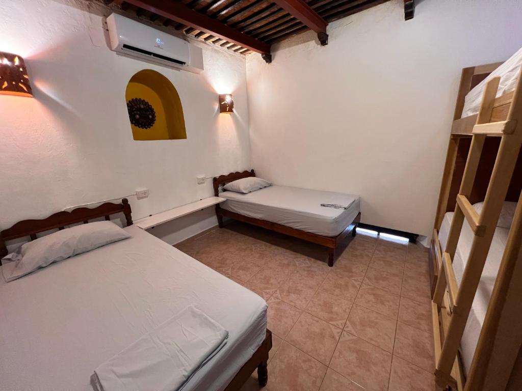 Ліжко або ліжка в номері Hostal Patio Nómada