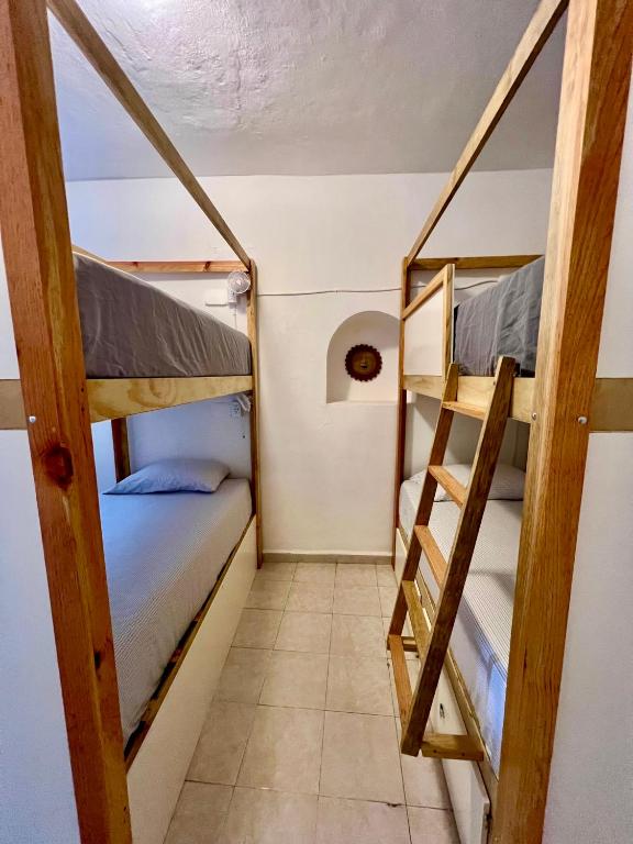 Ліжко або ліжка в номері Hostal Patio Nómada