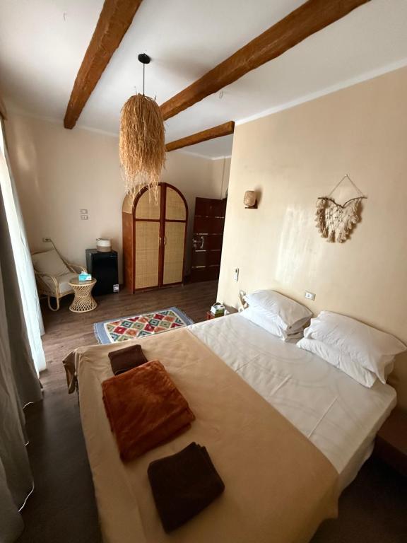 Postel nebo postele na pokoji v ubytování Beit Tolba Nuweiba