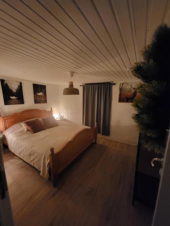 Postel nebo postele na pokoji v ubytování Le Grand Cerf gîte citadin