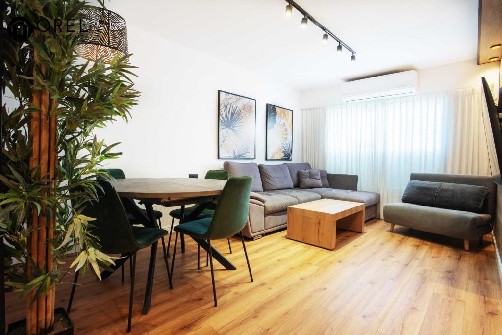 a living room with a couch and a table at orel's Top apartment in Eilat