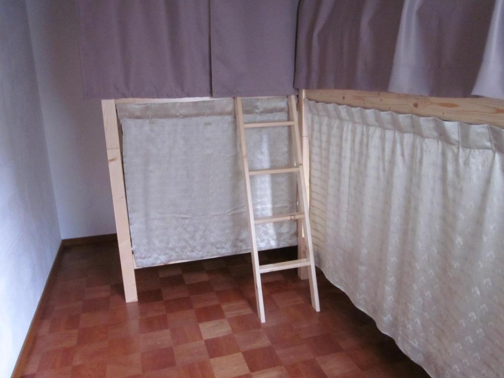 Postel nebo postele na pokoji v ubytování Enman Guest House Osaka