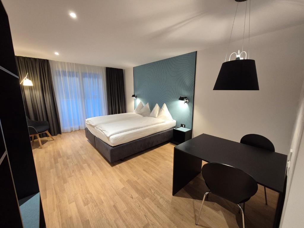 Postel nebo postele na pokoji v ubytování CENTRINO Apartments