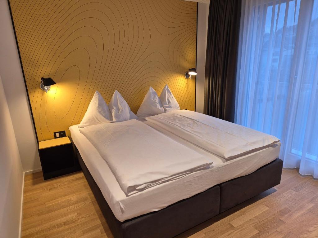 Postel nebo postele na pokoji v ubytování CENTRINO Apartments