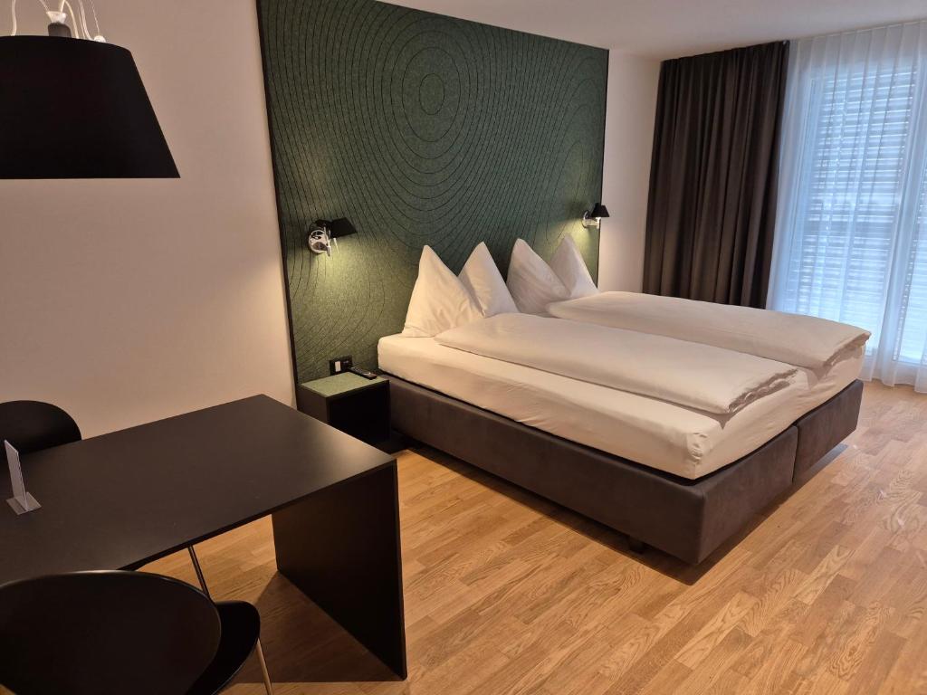Postel nebo postele na pokoji v ubytování CENTRINO Apartments