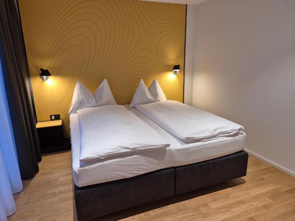 Postel nebo postele na pokoji v ubytování CENTRINO Apartments
