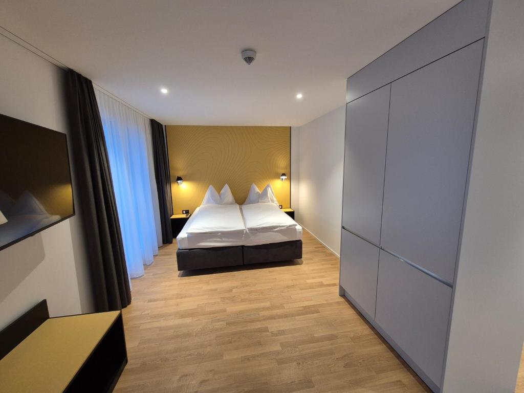 Postel nebo postele na pokoji v ubytování CENTRINO Apartments