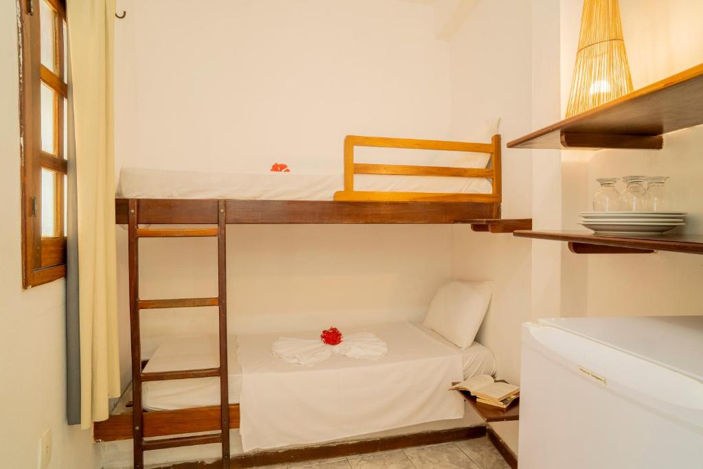Postel nebo postele na pokoji v ubytování Pousada Villa Tomasi