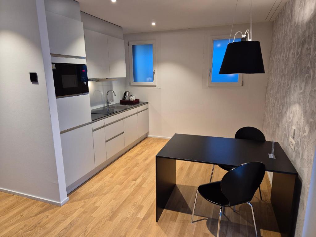 Kuchyň nebo kuchyňský kout v ubytování CENTRINO Apartments