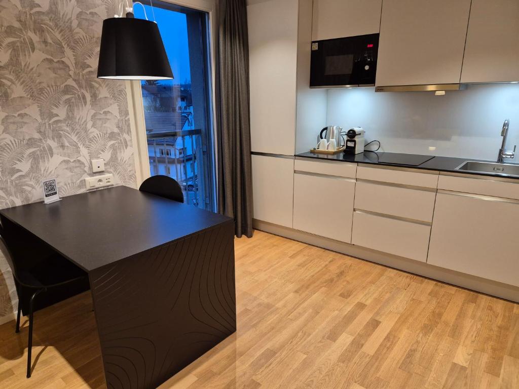 Kuchyň nebo kuchyňský kout v ubytování CENTRINO Apartments