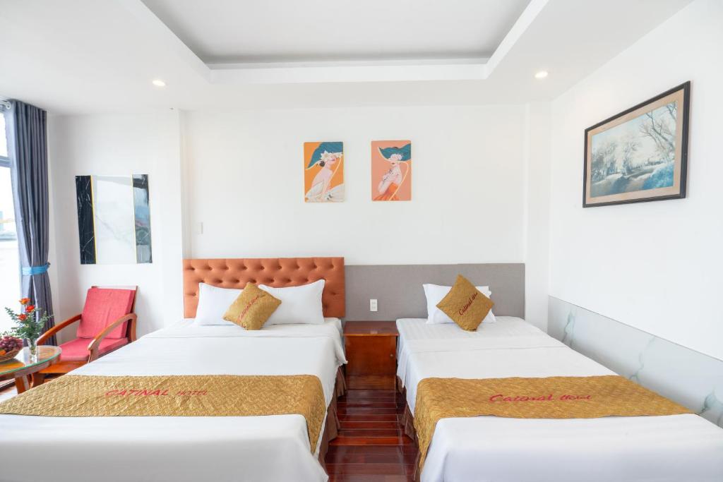 Postel nebo postele na pokoji v ubytování Danang Catinal Riverside Hotel
