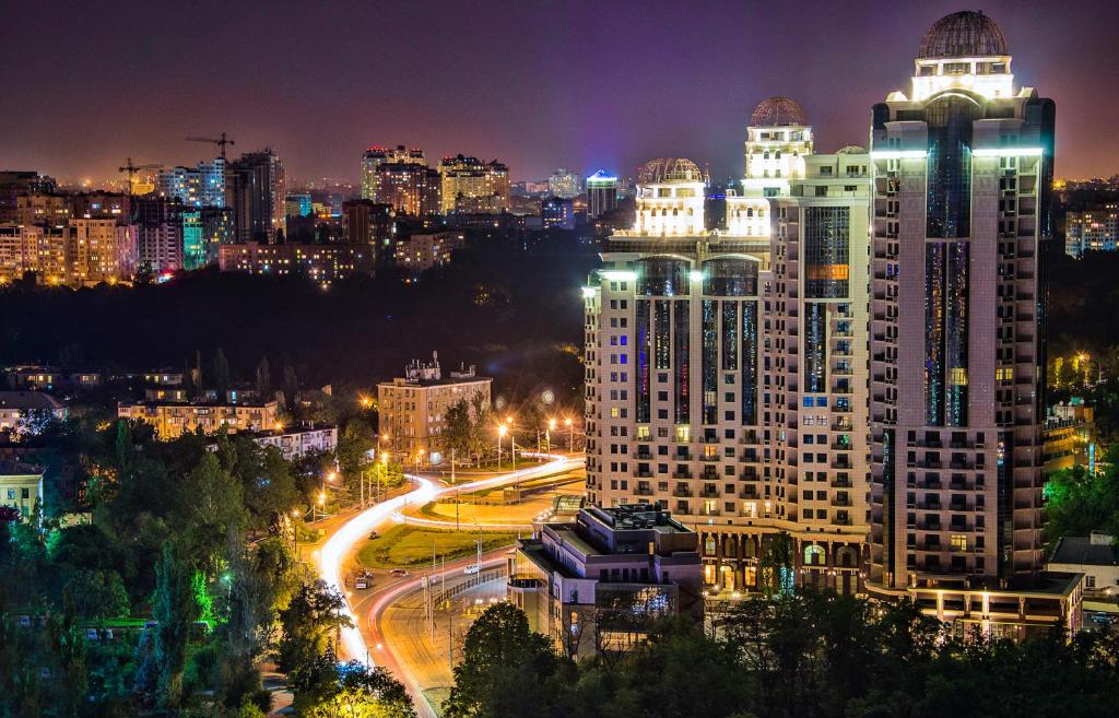 a view of a city at night with lights at Ark Palace Hotel & SPA in Odesa