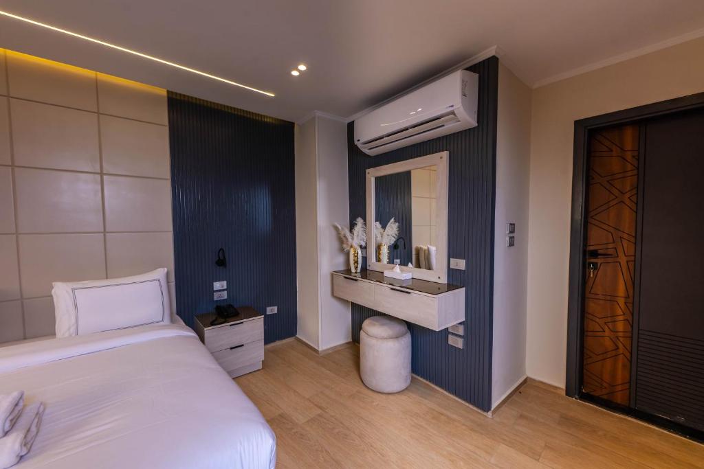 Postel nebo postele na pokoji v ubytování Remal Pyramids Hotel