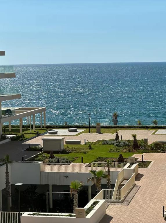 a view of the ocean from a building at Luxury Sea View -Gym-Pool-Carrousel Mall in Rabat