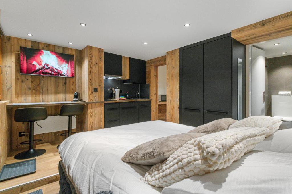 Postel nebo postele na pokoji v ubytování Studio rénové au centre de Saas-Fee