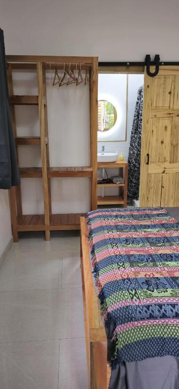 Postel nebo postele na pokoji v ubytování Bamboo Lodge