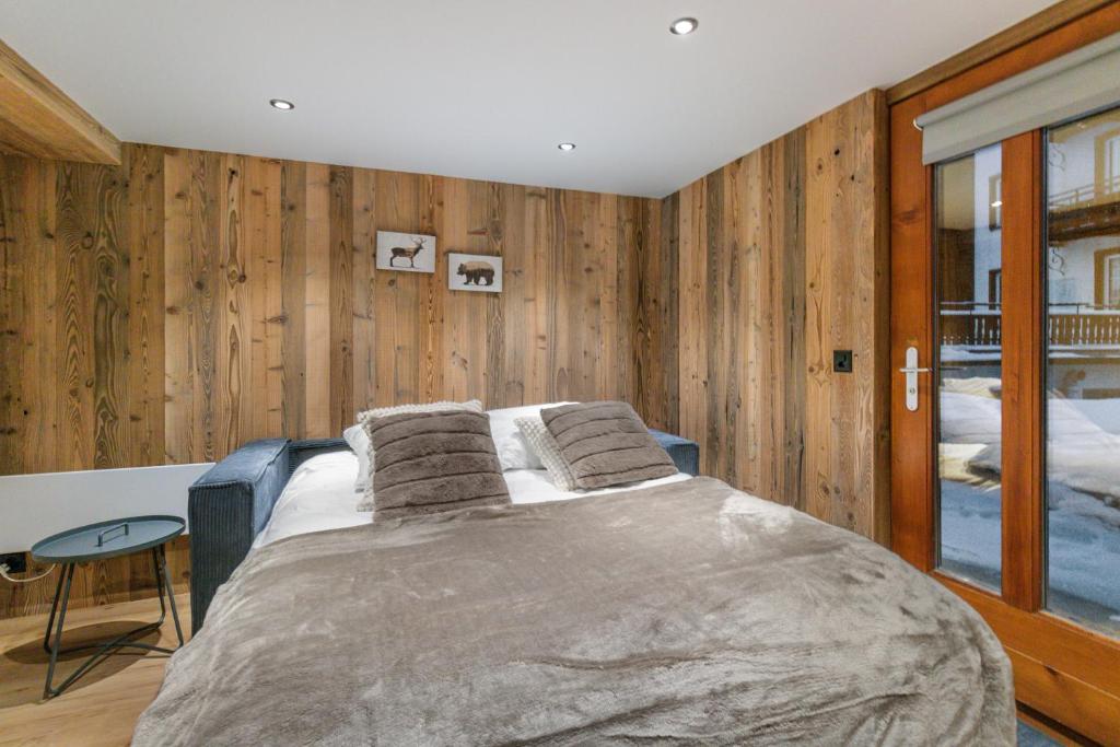 Postel nebo postele na pokoji v ubytování Studio rénové au centre de Saas-Fee