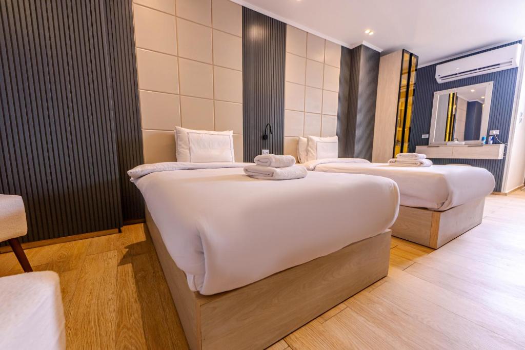 Postel nebo postele na pokoji v ubytování Remal Pyramids Hotel