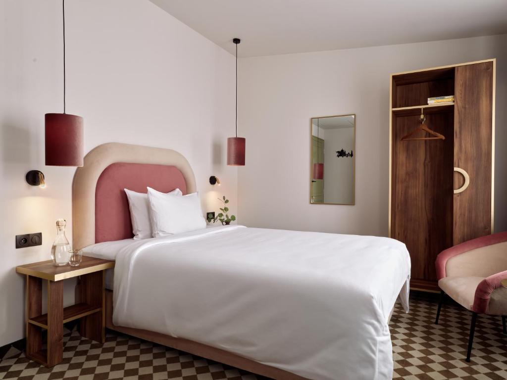 Postel nebo postele na pokoji v ubytování Hotel Pietryna