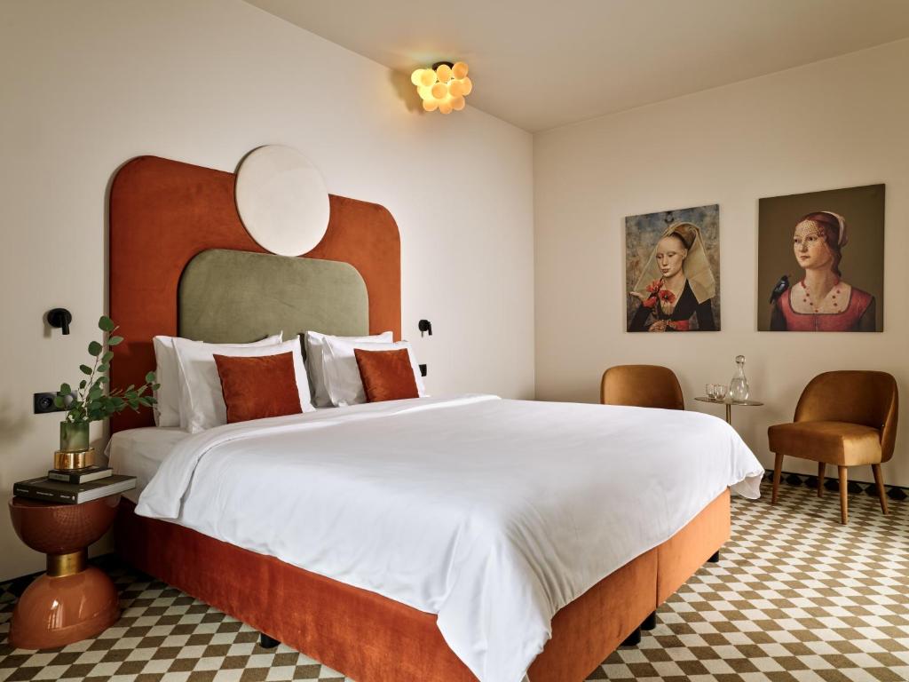 Postel nebo postele na pokoji v ubytování Hotel Pietryna