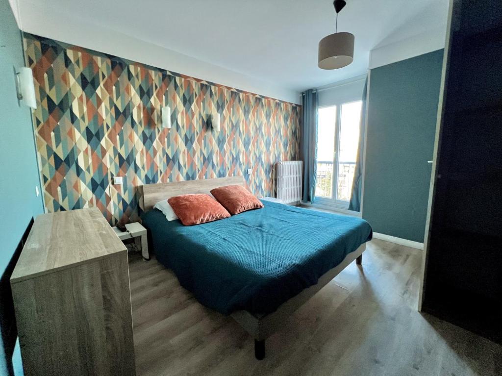 Postel nebo postele na pokoji v ubytování Hôtel Le Littoral - Berck sur Mer