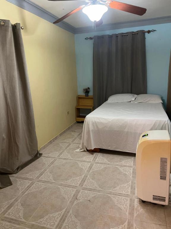 Llit o llits en una habitació de Hostal Bless house