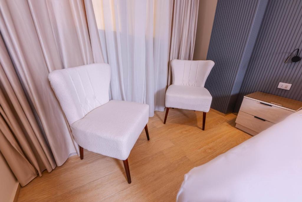 Postel nebo postele na pokoji v ubytování Remal Pyramids Hotel