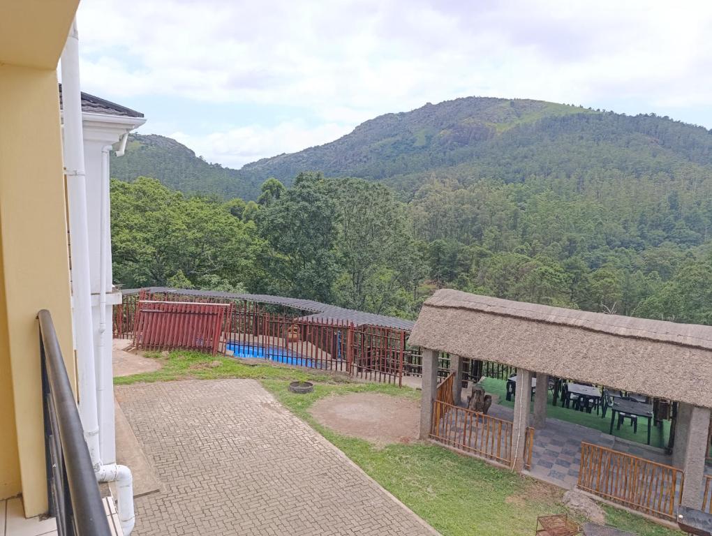 a view of a mountain from the balcony of a house at Thula Du Estate - family houses in Mbabane